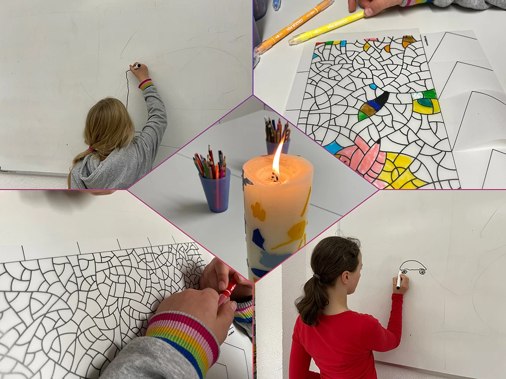 Kinder malen bunter Muster - In der Mitte eine brennende Kerze und Buntstifte